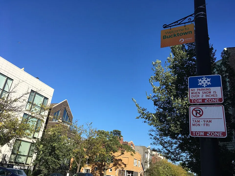 A Welcome to Bucktown banner on a street pole above a residential block